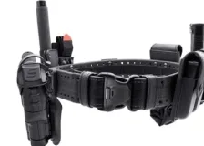 A close up of a police holster with assorted pockets for officers' equipment.