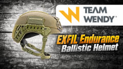 Team Wendy EXFIL Endurance ballistic helmet in olive green with tactical rails and chin strap, displayed alongside the Team Wendy logo and product headline against a textured black-and-gray background.