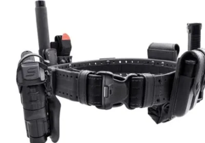 A close up of a police holster with assorted pockets for officers' equipment.