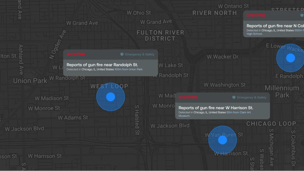 Dark map of downtown Chicago displaying three emergency alerts for reported gunfire near Randolph Street, W Harrison Street, and N Columbus Drive. Blue circular markers indicate locations near Union Park, Clark Art Museum, and Jack Academy High School.