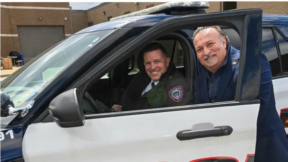 Officer smiling with an executive