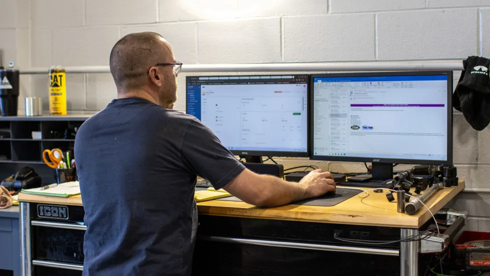 A man at a computer.