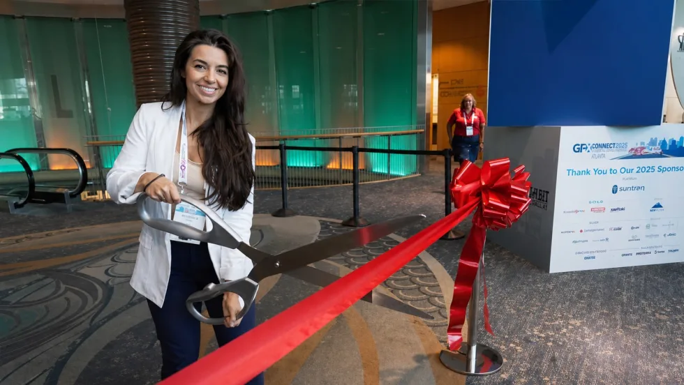 Nichole Osinski at GFX showcase floor ribbon cutting