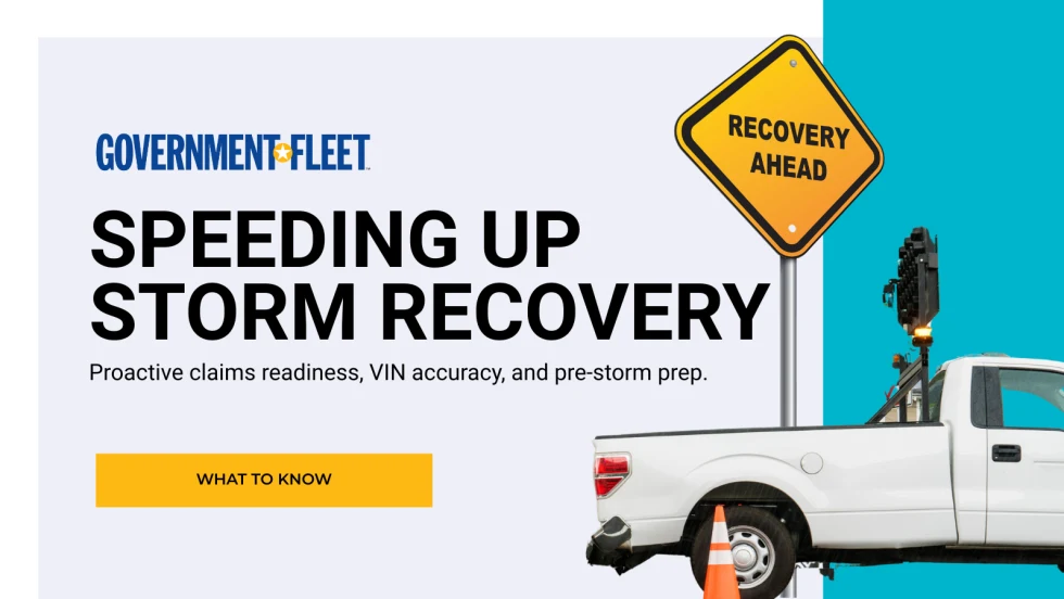 a TRUCK WITH RECOVERY AHEAD SIGN. 