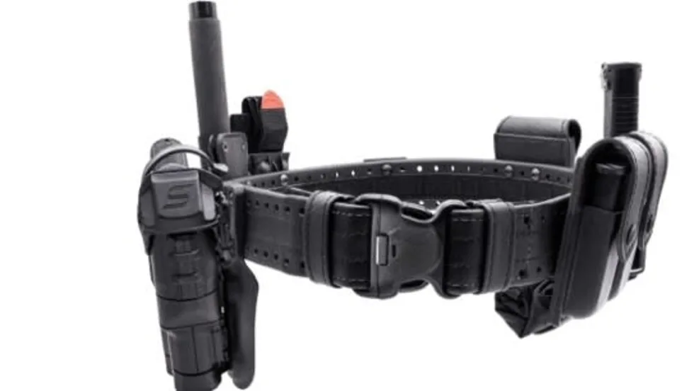 A close up of a police holster with assorted pockets for officers' equipment.
