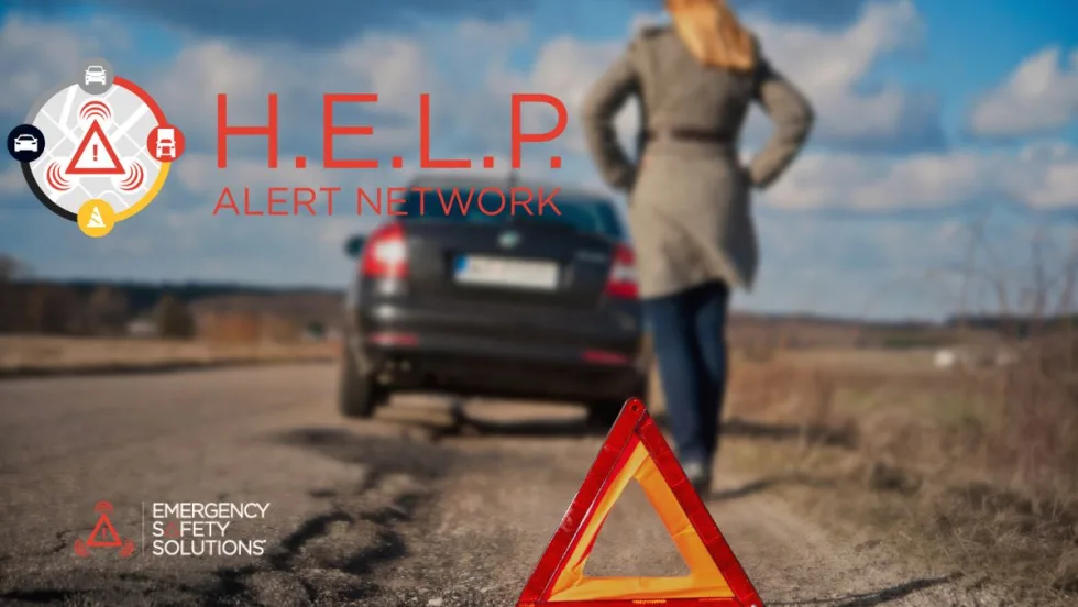 A woman walking toward her disabled car on the side of the road with a roadside alert triangle on the ground. 