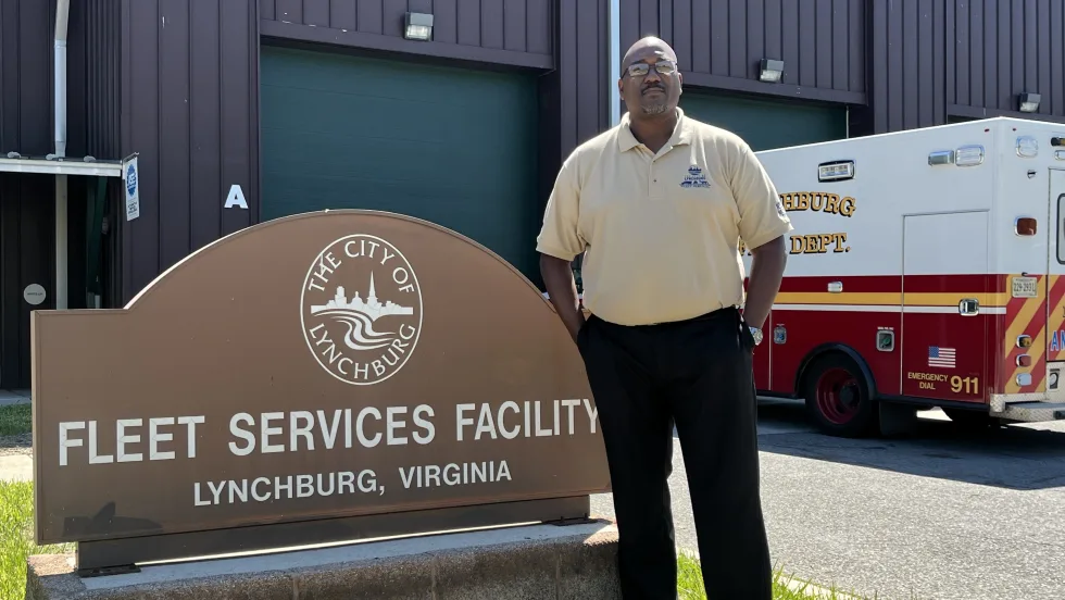 Ken Lett in front of the city fleet building.