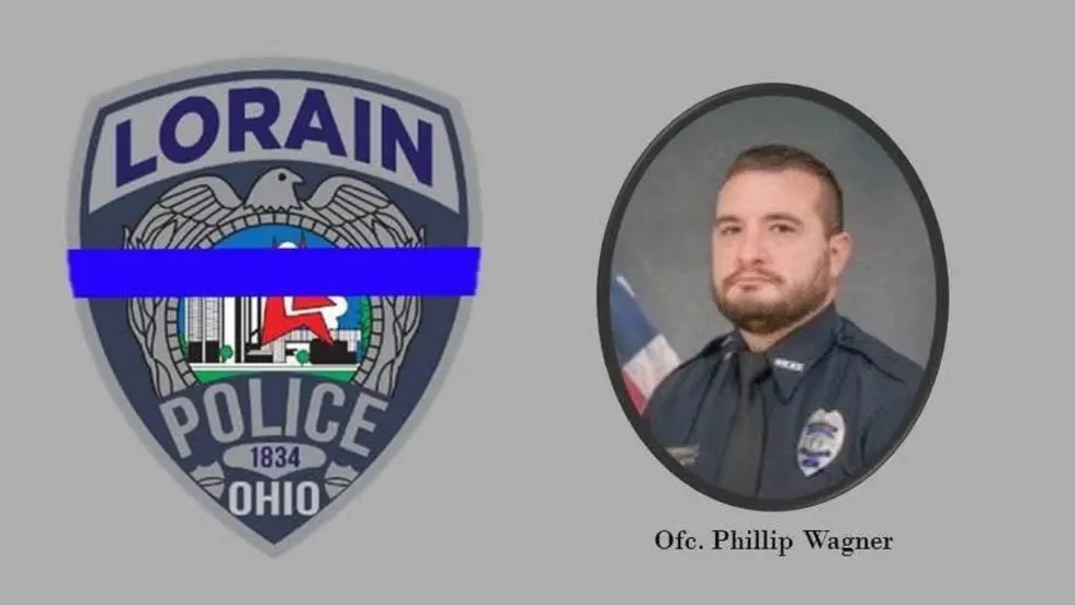 Lorain Police Department official badge and officer portrait with blue thin line emblem
