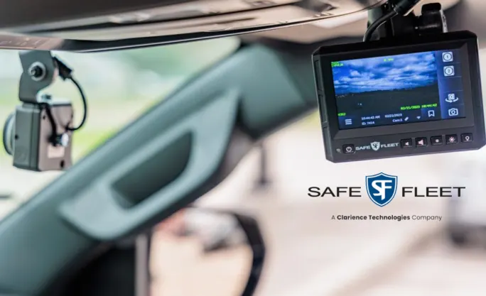 in-car view of windshield and a small screen with a video image