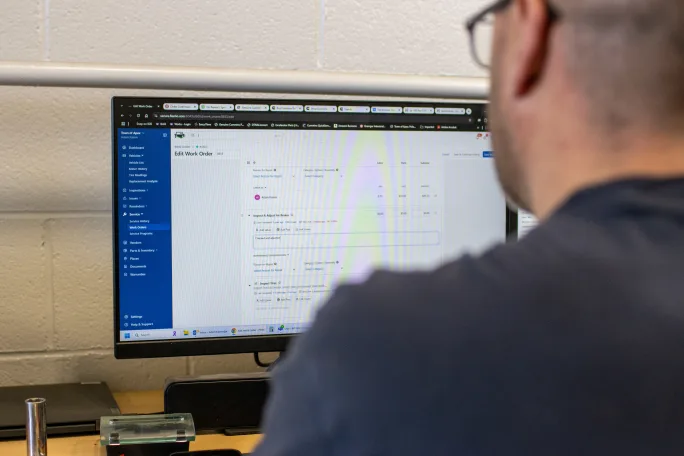 A man at a computer.