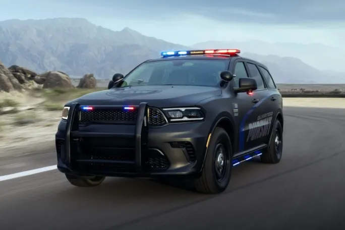 A Dodge Durango Pursuit is shown with lights activated.