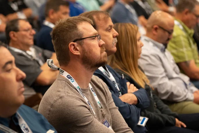 A group of GFX attendees listening to a session.