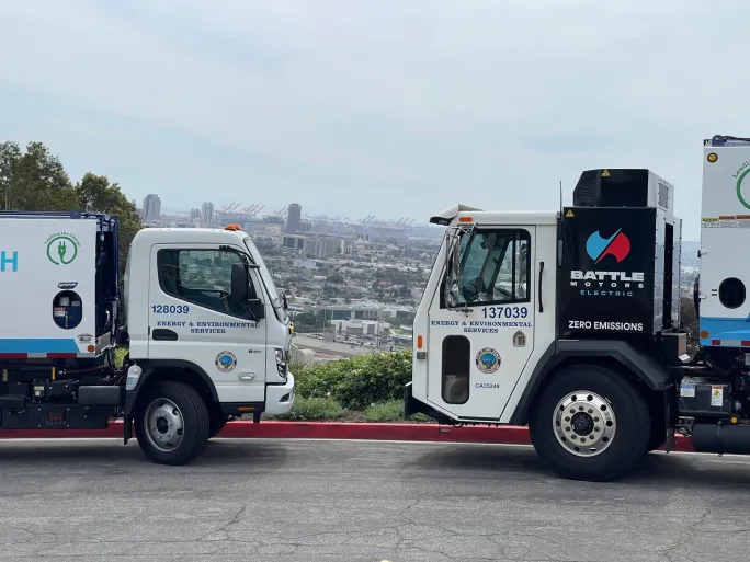 Two Long Beach refuse trucks.