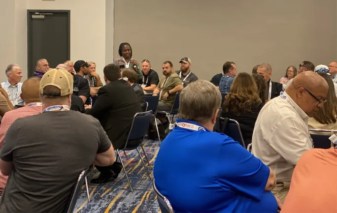 A GFX attendee speaking during a session.