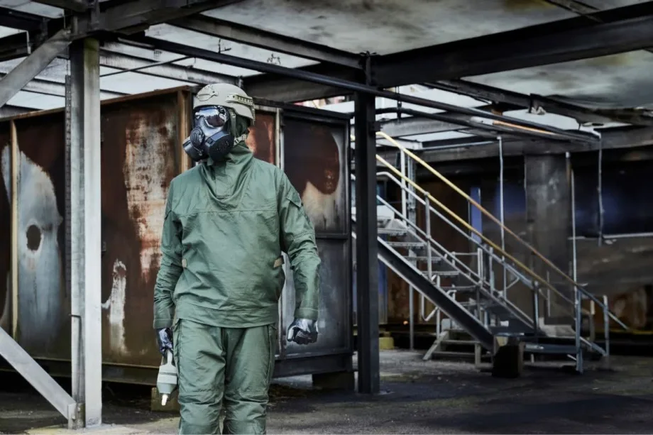 Person in protective CMRN suit and breathing gear.