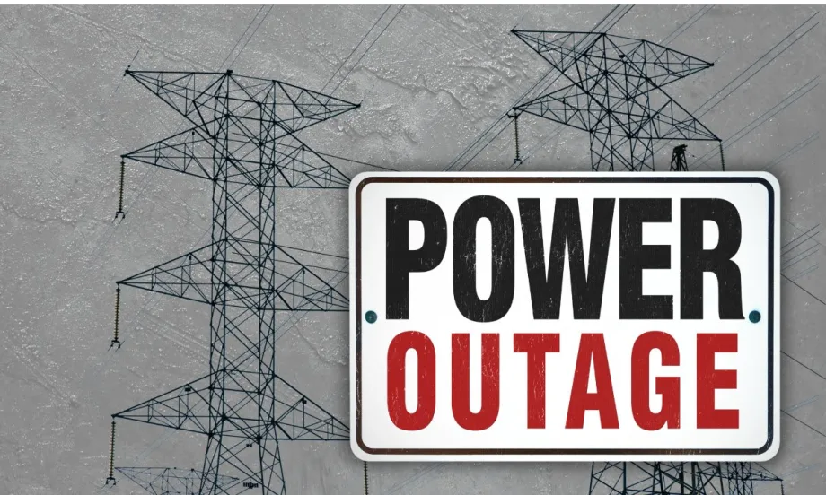 Power lines on a stormy day with the words POWER OUTAGE