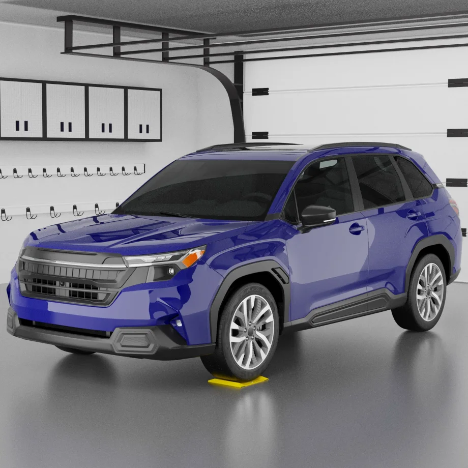Blue SUV parked in garage with front tire on yellow wheel spotting dish, demonstrating precise positioning aid for vehicle service and lift alignment.