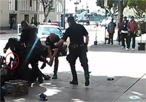 LAPD officers shot and killed a convicted bank robber Sunday after he reportedly tried to grab one of the the officers' guns.