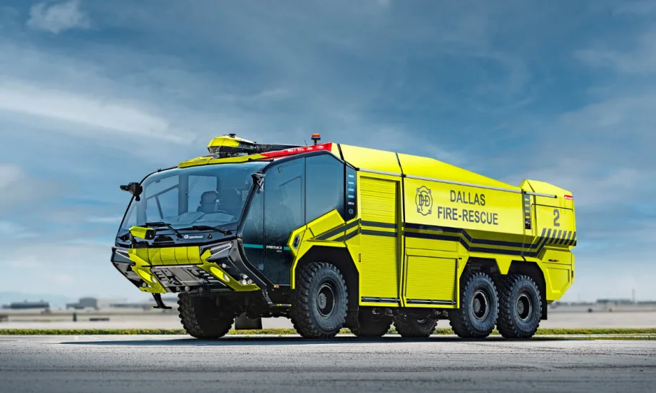 A bright yellow aircraft rescue firefighting truck is shown.